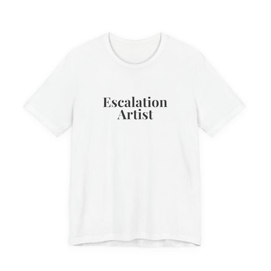 Front of the white “Escalation Artist” tee