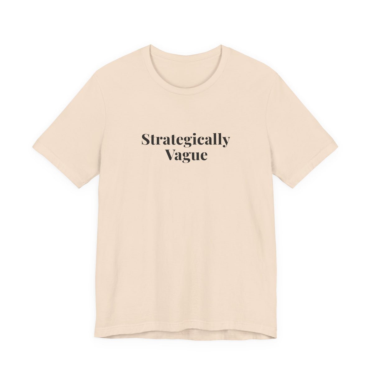 Soft cream “Strategically Vague” tee, shown from the front
