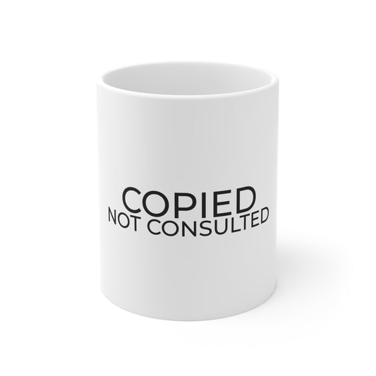“Copied Not Consulted” 11 oz mug, shown from the front