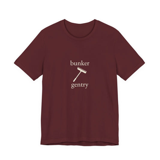 Maroon “Bunker Gentry” golf tee, front view with the centre-chest print