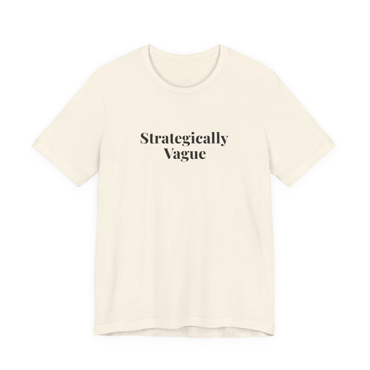 Front of the natural “Strategically Vague” tee