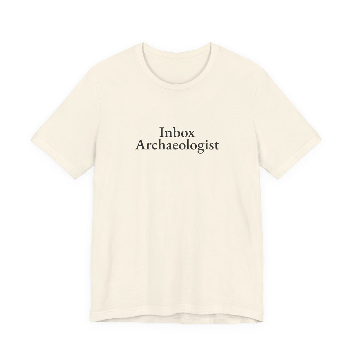 Front print on the natural “Inbox Archaeologist” tee
