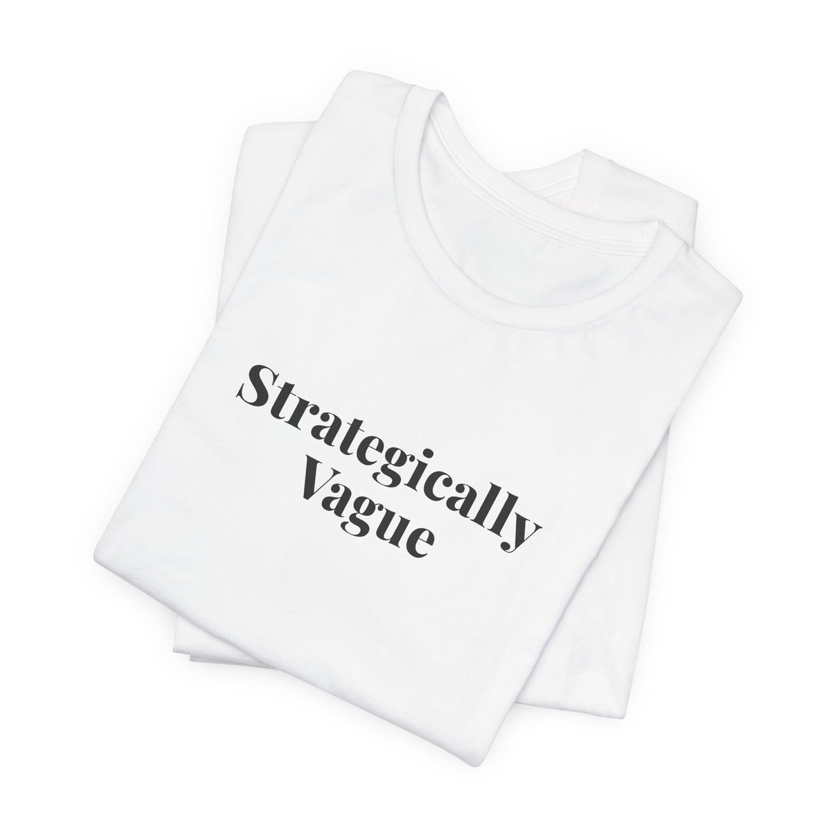 The white “Strategically Vague” tee folded flat