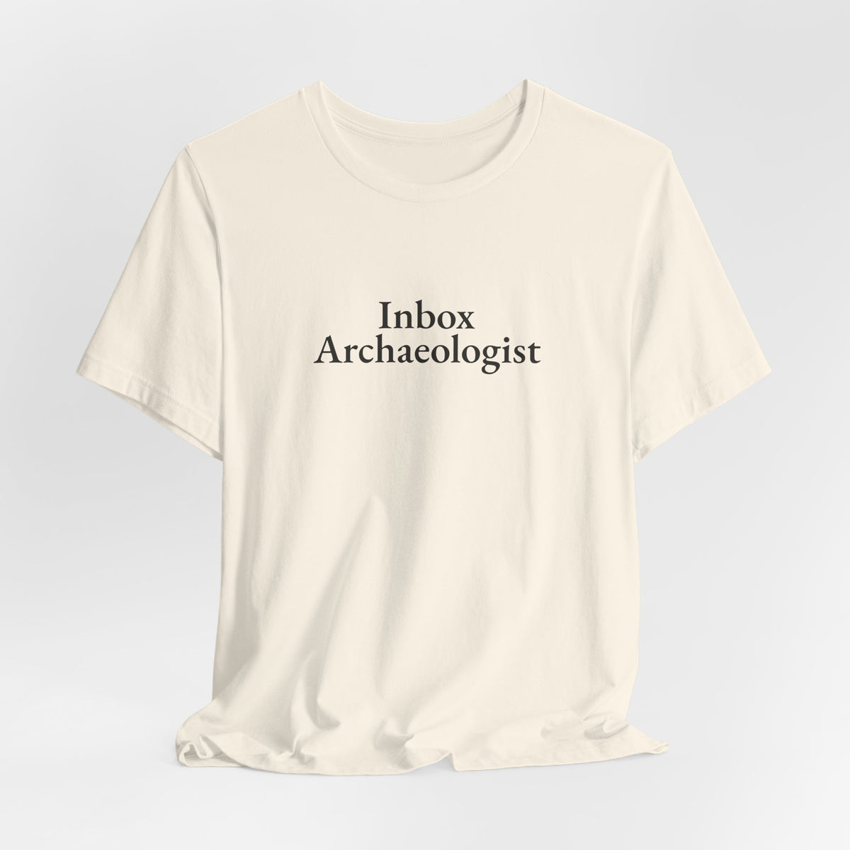 Hanging natural “Inbox Archaeologist” tee, front print